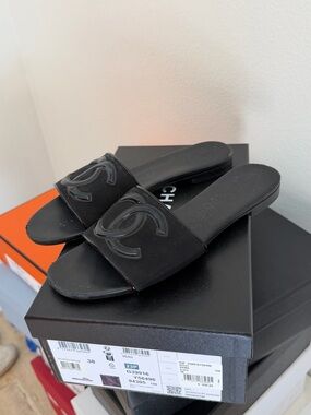 CHANEL Black Slide Sandals with Raised CC Emblem